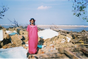 Photo by Holly Michael, Tamilarisa in the remains of her home
